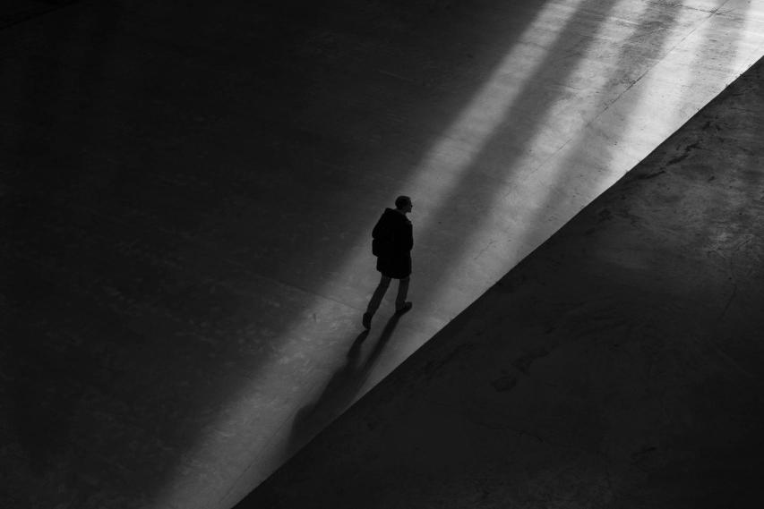 Image of a lone figure walking
